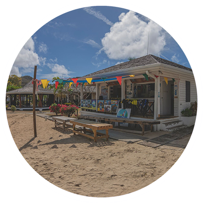 A picture of a beach hut with flags on it, near the Grenada snorkeling area.